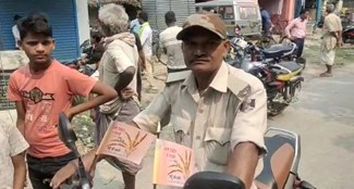 Policeman walking around with candidate's flag  This view was given in the Bihar Panchayat elections, if caught, make excuses