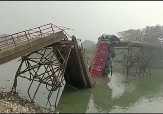 the truck was passing with sand,then the bridge broke and diveided into two parts.