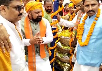 BJP workers weighed Samrat Chaudhary with mangoes and laddoos.