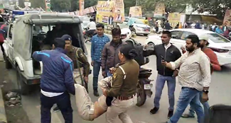Policemen chased and beat up a police friend who was gheraoing the BJP office