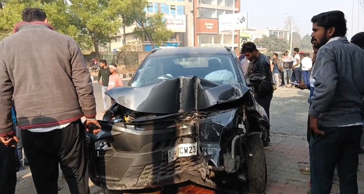 Two people standing by the roadside were injured.