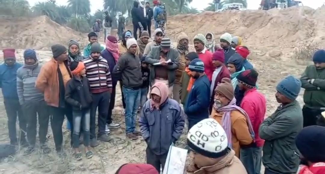 The body of a young man was found near a pond in Deoghar, causing panic in the village.